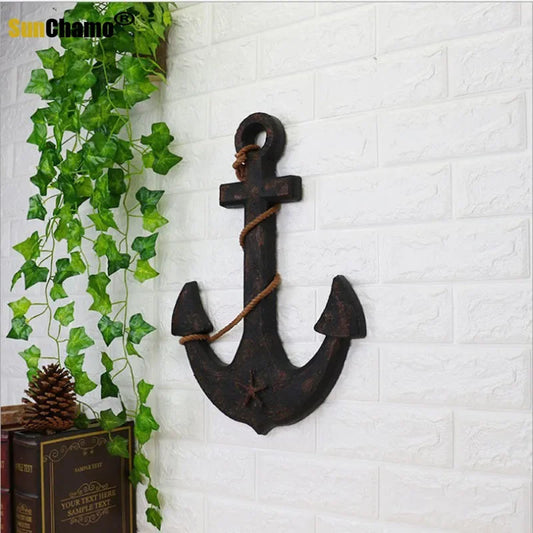 Add Nautical Charm with the Wood Mediterranean Ship Rudder and Anchor Wall Decor