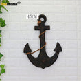 Load image into Gallery viewer, Add Nautical Charm with the Wood Mediterranean Ship Rudder and Anchor Wall Decor
